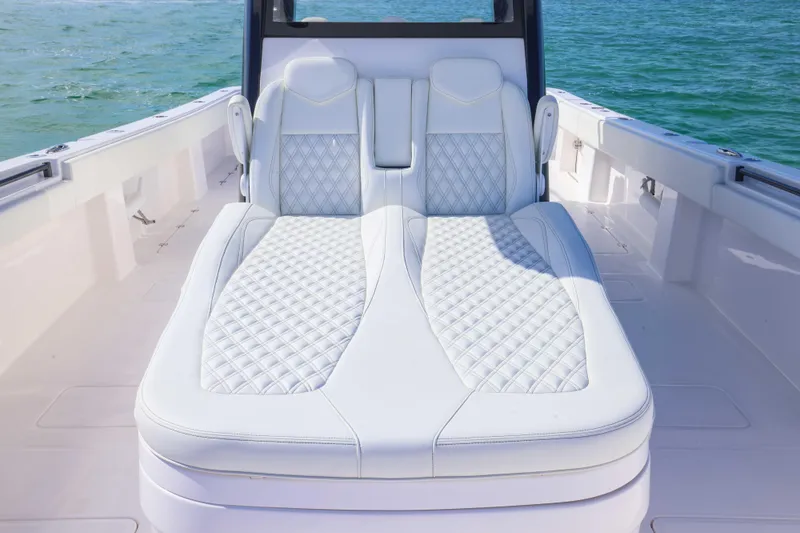 Slide: The Image of Luxurious seating on 2025 Invincible 35 Catamaran, featuring elegant white upholstery. - 10