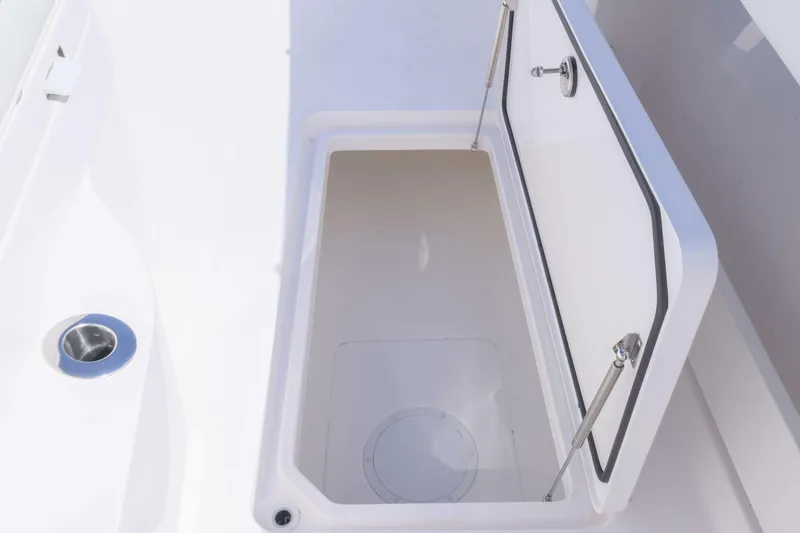 Slide: The Image of Open storage compartment on 2025 Invincible 35 Catamaran boat. - 12