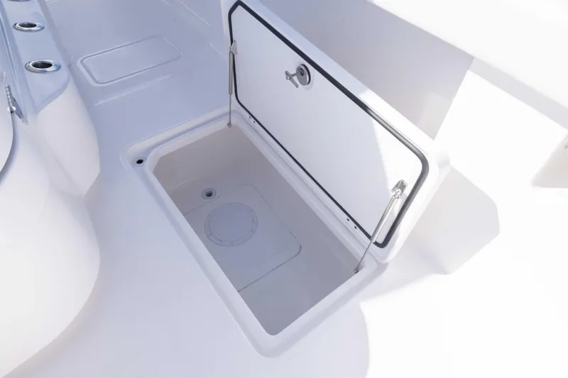 Slide: The Image of Open storage compartment on 2025 Invincible 35 Catamaran boat deck. - 13
