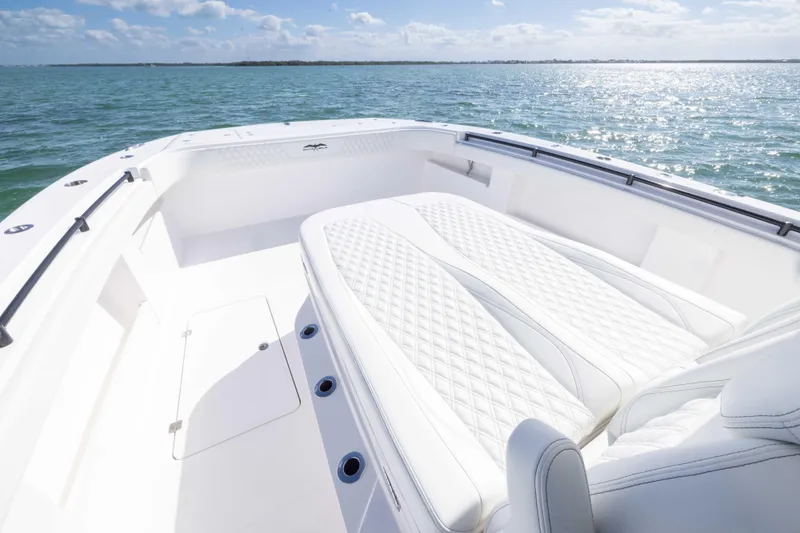 Slide: The Image of 2025 Invincible 35 Catamaran with luxurious seating, cruising on a sunny day. - 15