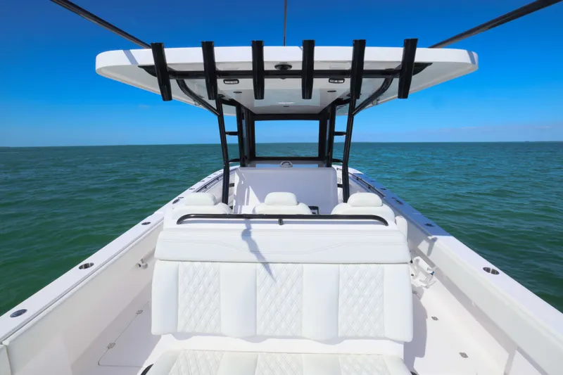 Slide: The Image of 2025 Invincible 35 Catamaran on open water, featuring sleek design and spacious seating. - 22