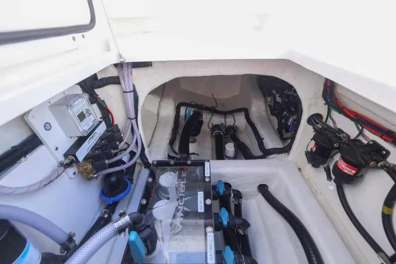 Slide: The Image of Engine compartment of 2025 Invincible 35 Catamaran, showcasing wiring and mechanical components. - 27