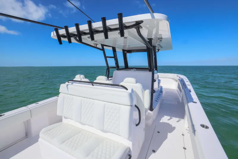 Slide: The Image of 2025 Invincible 35 Catamaran on open sea, featuring sleek white seating and modern design. - 29