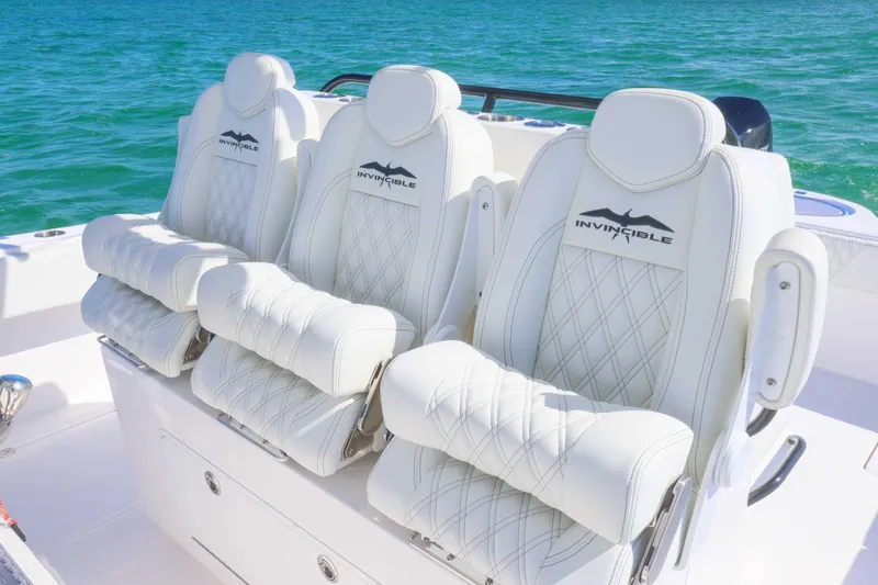 Slide: The Image of Luxurious seating on 2025 Invincible 35 Catamaran, featuring white leather and diamond stitching. - 30