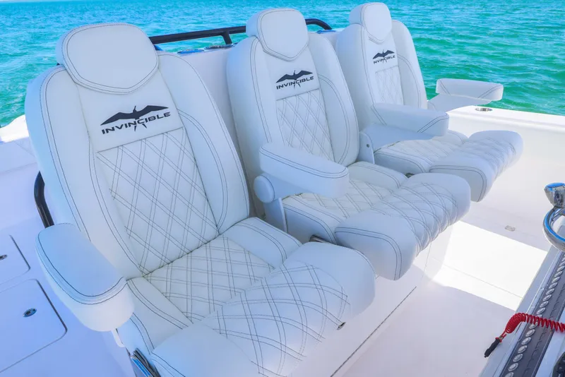 Slide: The Image of Luxurious seating on 2025 Invincible 35 Catamaran, featuring white leather with diamond stitching. - 31