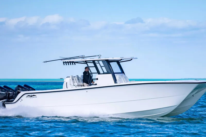 Slide: The Image of 2025 Invincible 35 Catamaran cruising on blue ocean waters. - 40