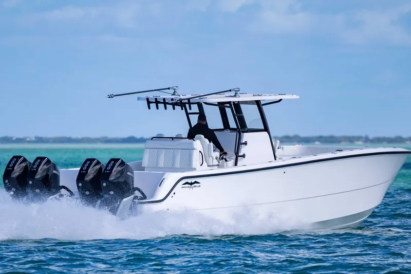 Slide: The Image of 2025 Invincible 35 Catamaran speeding on open water, showcasing powerful engines and sleek design. - 42