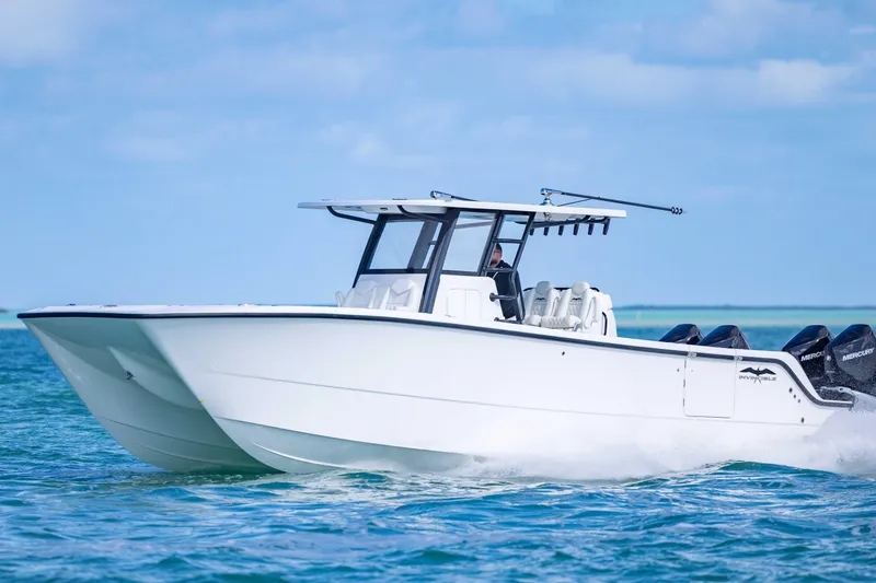 Slide: The Image of 2025 Invincible 35 Catamaran cruising on blue ocean waters. - 44