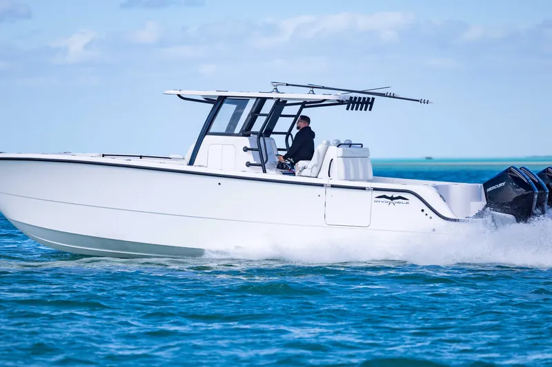 Slide: The Image of 2025 Invincible 35 Catamaran cruising on blue ocean waters. - 46