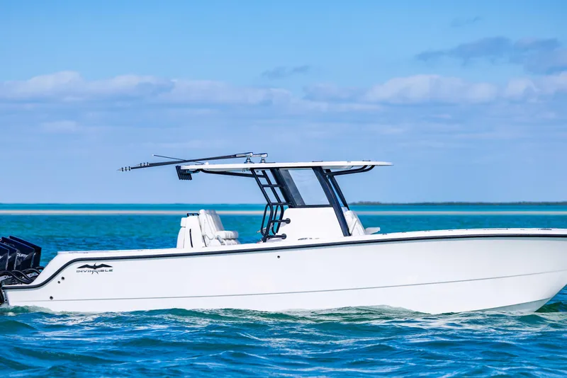 Slide: The Image of 2025 Invincible 35 Catamaran cruising on clear blue waters under a sunny sky. - 6