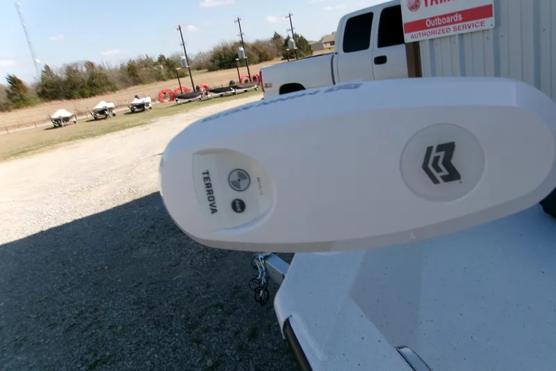 Slide: The Image of 2026 Xpress H22B Bay boat with Terrova trolling motor in outdoor setting. - 16