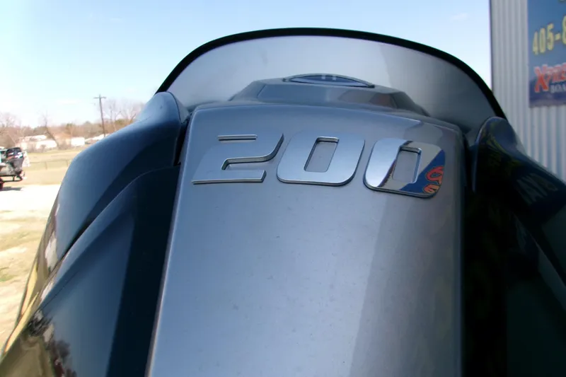 Slide: The Image of Close-up of 2026 Xpress H22B Bay boat engine with '200' emblem. - 2