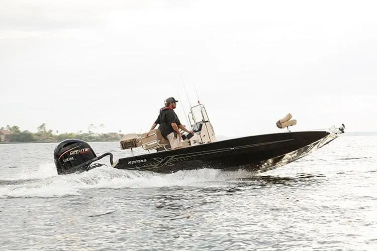 Slide: The Image of Manufacturer Provided Image: 2026 Xpress H22B Bay boat cruising on open water with Yamaha engine. - 26