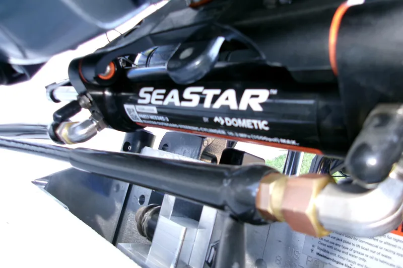 Slide: The Image of Close-up of SeaStar hydraulic steering system on 2026 Xpress H22B Bay boat. - 5