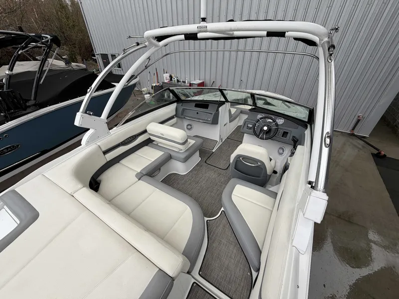 Slide: The Image of Interior view of a 2017 Cobalt CS1 boat with white seating. - 10
