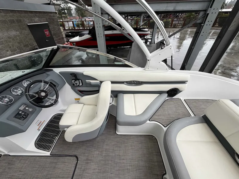 Slide: The Image of Interior of a 2017 Cobalt CS1 boat with steering wheel and seats. - 11