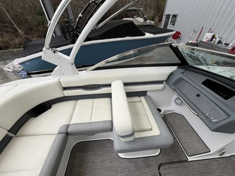 Slide: The Image of Interior of a 2017 Cobalt CS1 boat with white and gray upholstery. - 13