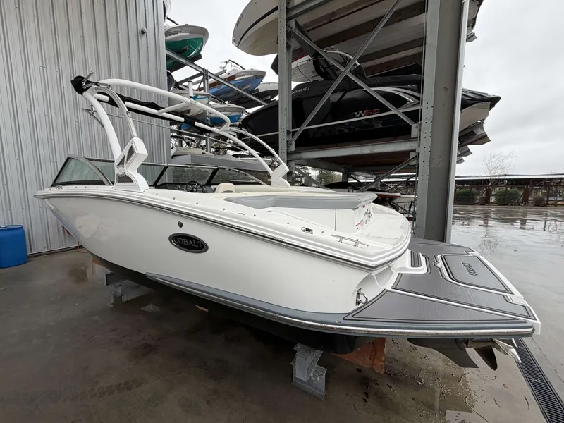 Slide: The Image of 2017 Cobalt CS1 boat in storage facility, side view. - 2