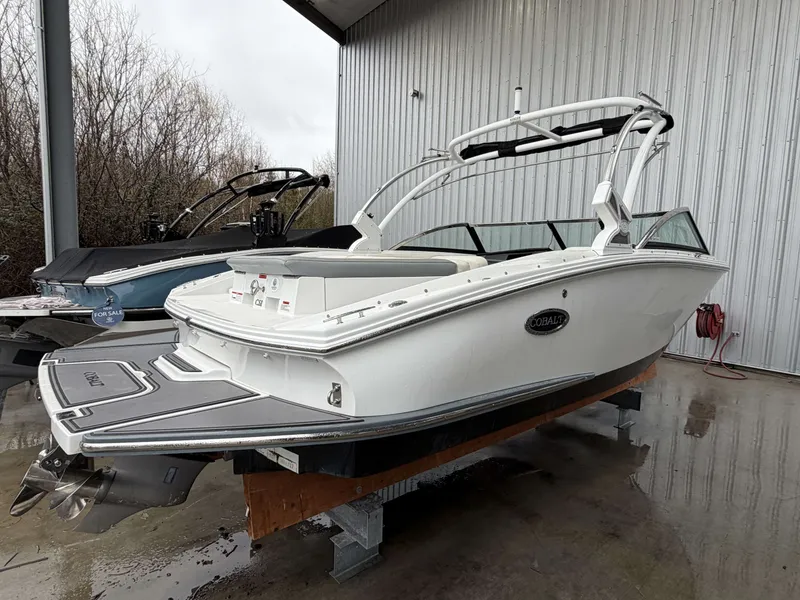 Slide: The Image of 2017 Cobalt CS1 boat in warehouse, white design. - 4
