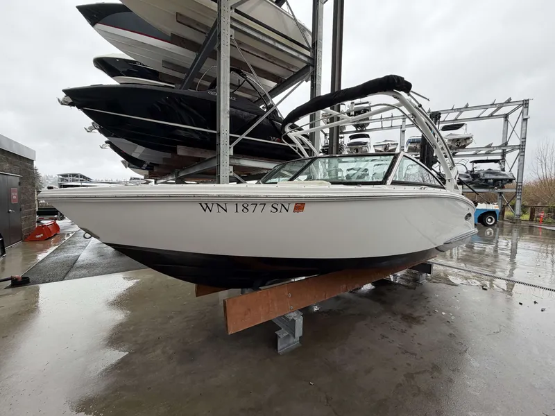 Slide: The Image of 2017 Cobalt CS1 boat on storage rack in rainy weather. - 8