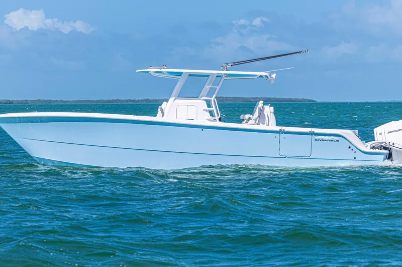 The Image of 2025 Invincible 35 Catamaran cruising on blue ocean waters under clear skies. - 0