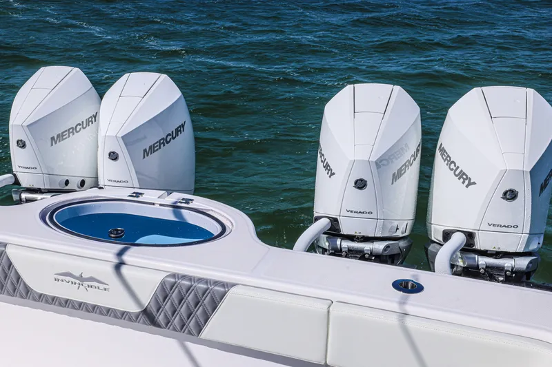 Slide: The Image of 2025 Invincible 35 Catamaran with four Mercury Verado engines on the water. - 17