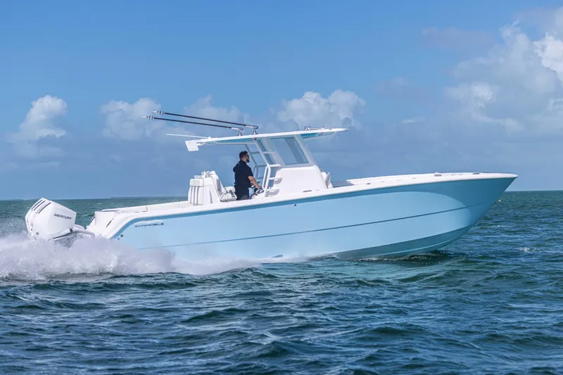 Slide: The Image of 2025 Invincible 35 Catamaran cruising on open water under clear skies. - 33