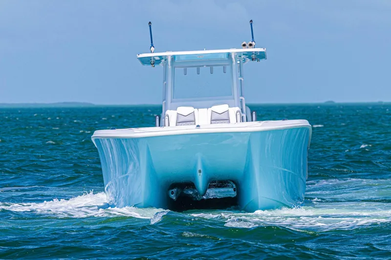 Slide: The Image of 2025 Invincible 35 Catamaran cruising on open water, showcasing sleek design and performance. - 4