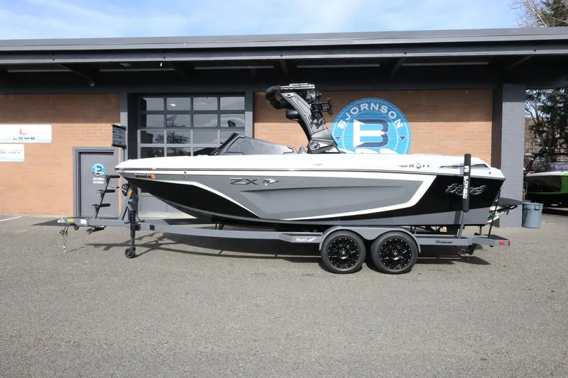 The Image of 2022 Tigé 23ZX boat on trailer outside Bjornson building. - 1