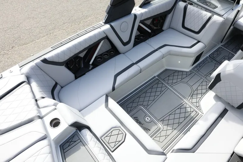 Slide: The Image of Luxurious interior of 2022 Tigé 23ZX boat with quilted seating and stylish flooring. - 13
