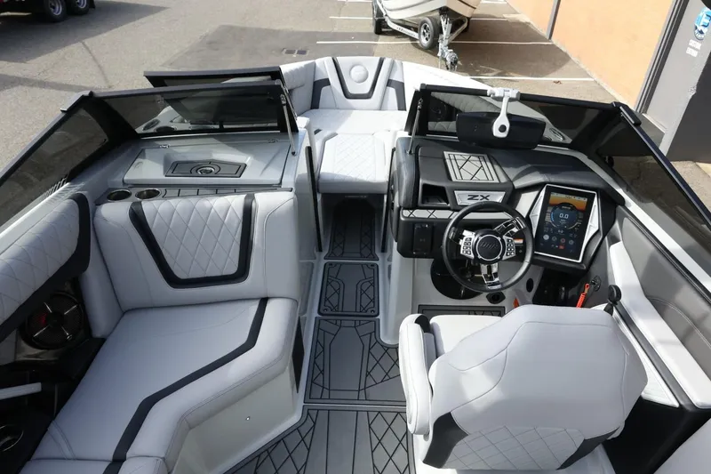 Slide: The Image of 2022 Tigé 23ZX boat interior with modern dashboard and luxurious seating. - 15