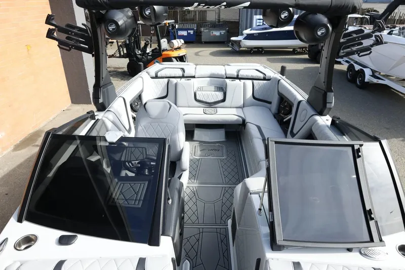 Slide: The Image of 2022 Tigé 23ZX boat interior with luxurious seating and advanced dashboard features. - 19