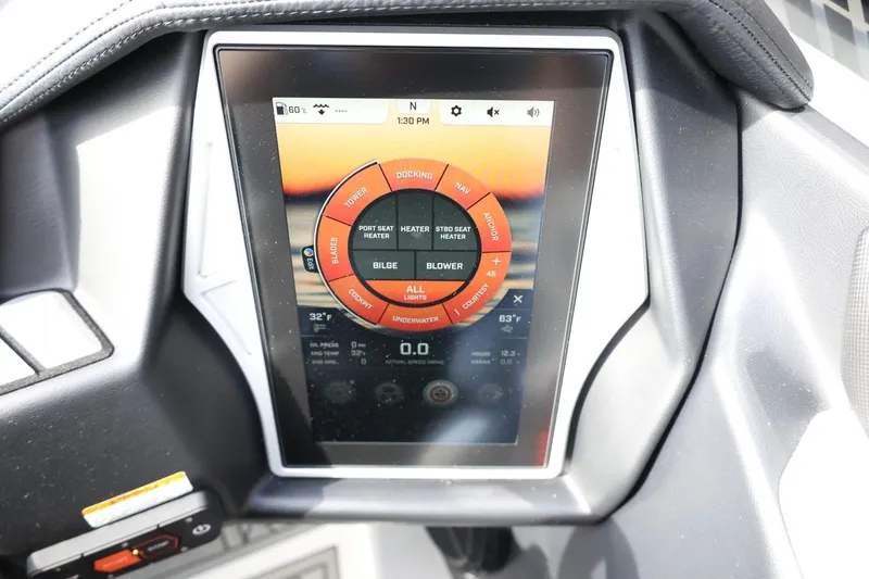 Slide: The Image of Touchscreen control panel in 2022 Tigé 23ZX boat dashboard. - 24