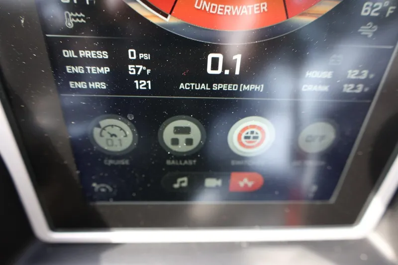 Slide: The Image of Dashboard display of a 2022 Tigé 23ZX boat showing engine metrics and speed. - 25