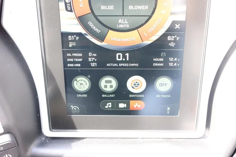 Slide: The Image of 2022 Tigé 23ZX touchscreen display showing engine stats and control options. - 26