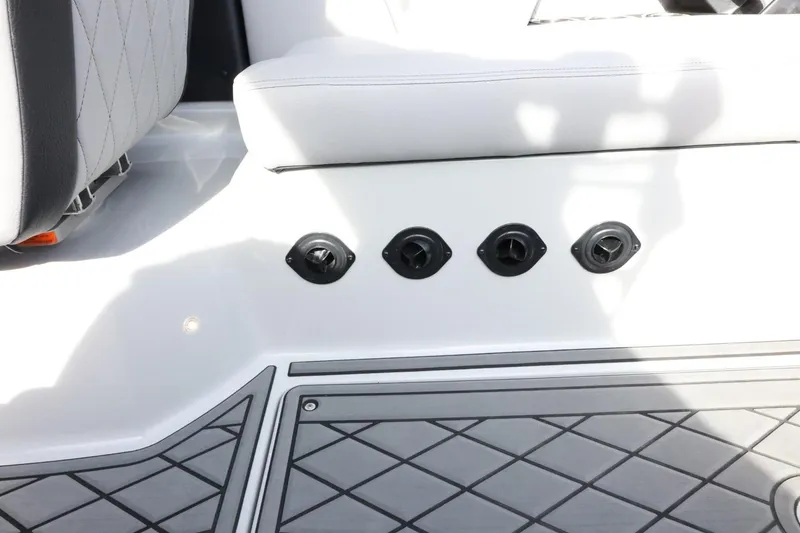 Slide: The Image of 2022 Tigé 23ZX boat interior with seating and control panel details. - 30