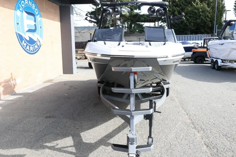 Slide: The Image of 2022 Tigé 23ZX boat on trailer at Bjornson Marine dealership. - 4