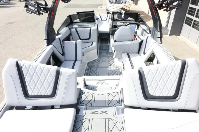 Slide: The Image of 2022 Tigé 23ZX boat interior with luxurious seating and modern design. - 42