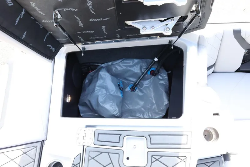 Slide: The Image of 2022 Tigé 23ZX boat storage compartment with ballast bag and hydraulic lift. - 43