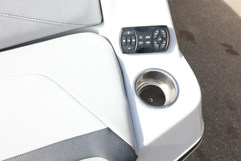 Slide: The Image of 2022 Tigé 23ZX boat interior with control panel and cup holder. - 45