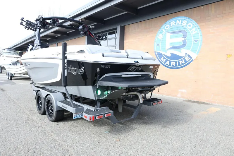 Slide: The Image of 2022 Tigé 23ZX boat on trailer at Bjornson Marine dealership. - 9