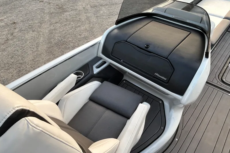 Slide: The Image of 2023 Manitou 270 boat interior with sleek seating and modern dashboard design. - 10