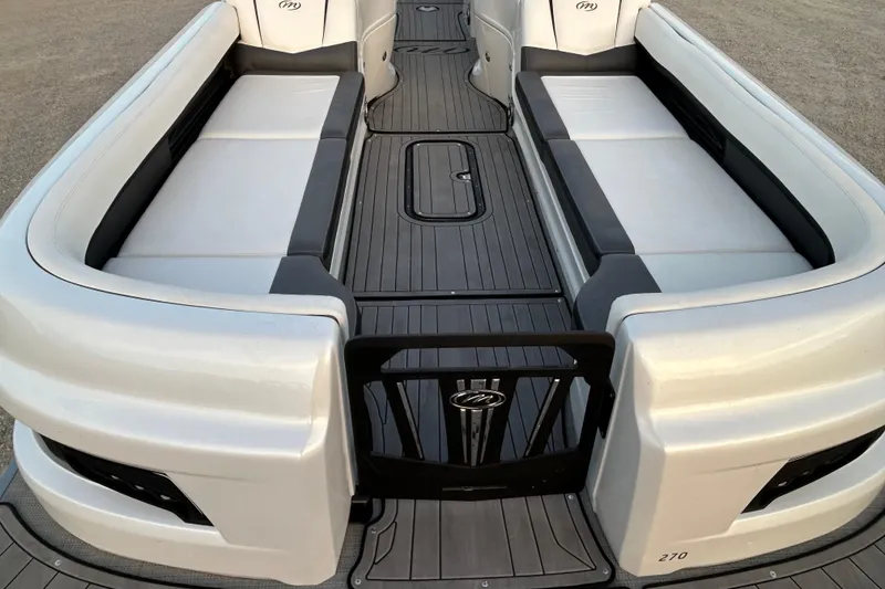 Slide: The Image of 2023 Manitou 270 boat interior with sleek seating and modern design. - 14