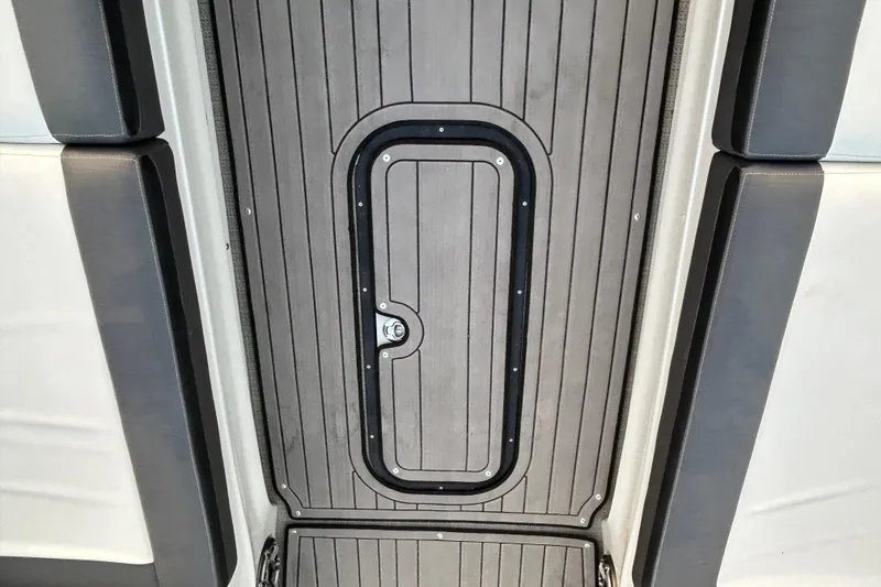 Slide: The Image of 2023 Manitou 270 boat floor with sleek, modern design and secure hatch. - 15