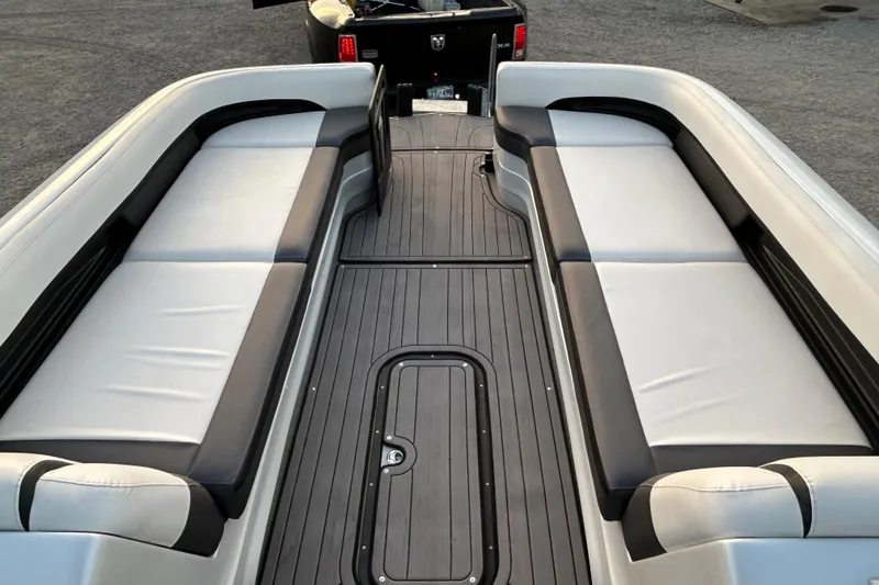 Slide: The Image of 2023 Manitou 270 boat interior with sleek seating and modern design. - 9