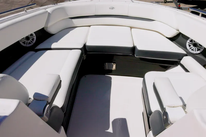 Slide: The Image of Luxurious seating area on a 2017 Regal 29 OBX boat, featuring white upholstery. - 4