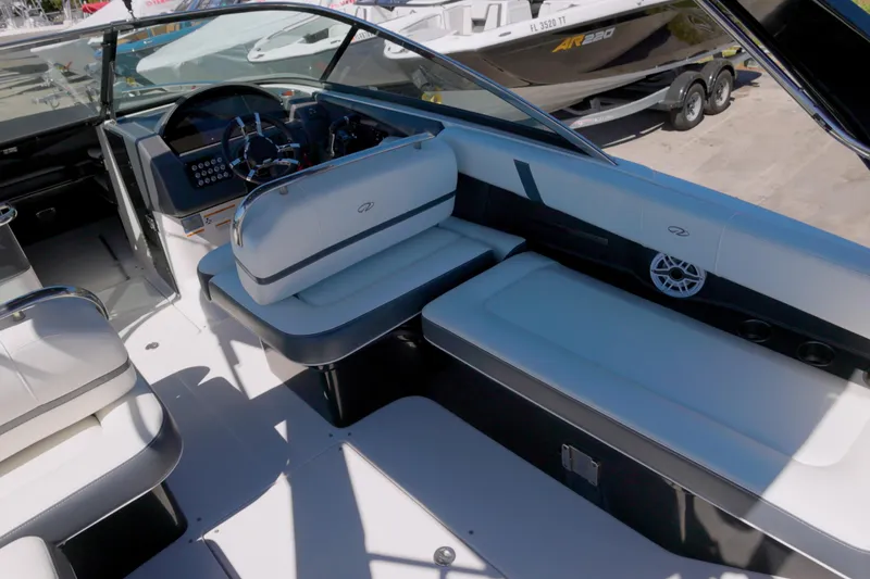 Slide: The Image of 2017 Regal 29 OBX boat interior with sleek seating and modern dashboard. - 8