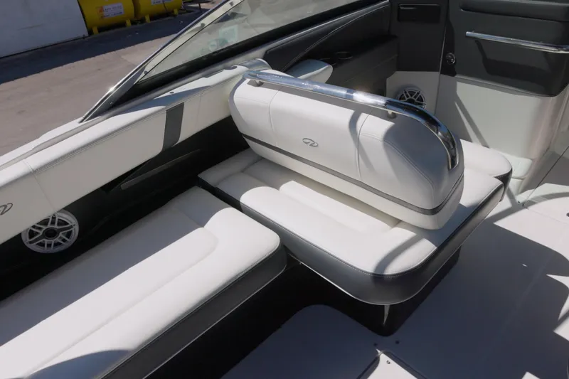 Slide: The Image of 2017 Regal 29 OBX boat interior with white leather seating and chrome accents. - 6