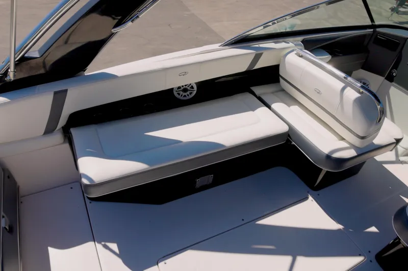 Slide: The Image of 2017 Regal 29 OBX boat interior with white seating and sleek design. - 9