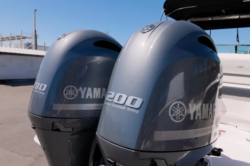 Slide: The Image of Twin Yamaha 200 outboard engines on a 2017 Regal 29 OBX boat. - 15